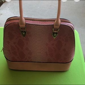 Pink purse with snake texture